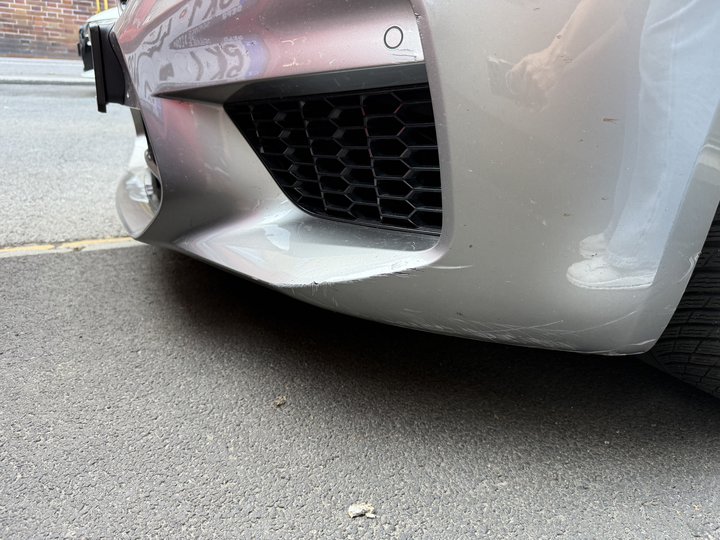 Scratches on the lower right edge of the front bumper
